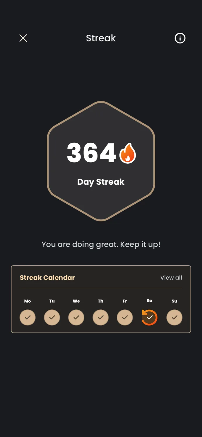 A 364-day streak badge on the Catch the Ghost app, with an encouragement message and a weekly streak calendar below it.